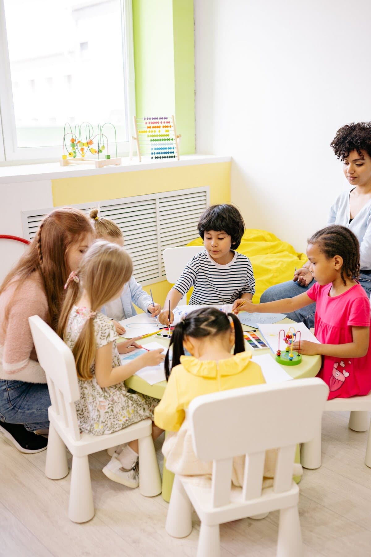Children learning together in a bright classroom